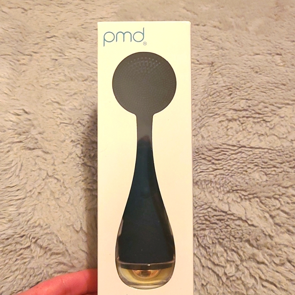 PMD Smart facial cleansing device in navy blue